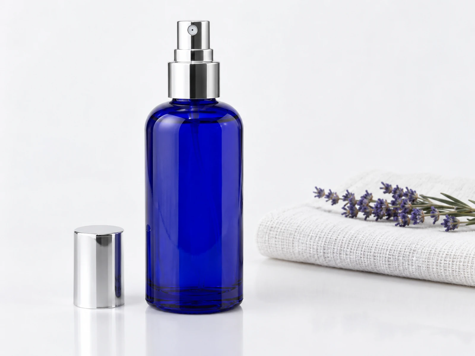Fine-mist room and linen spray bottles in a clean product setting 4